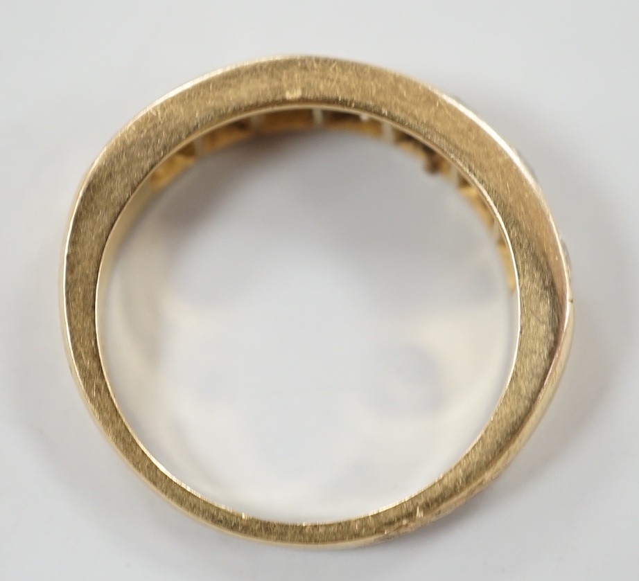 A modern 18ct gold and seven stone diamond set half hoop ring, size P, gross weight 5.3 grams.